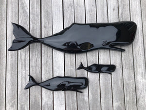 wood carved whales